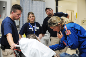 Galveston Island, Texas, September 18, 2008 - Members of the Iowa-1 Disaster Medical Assistance Team help to move a patient out of the area impacted by Hurricane Ike. (Jocelyn Augustino/FEMA)